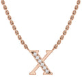 Rose gold chain necklace with an X pendant, accented with small clear gemstones in the center.