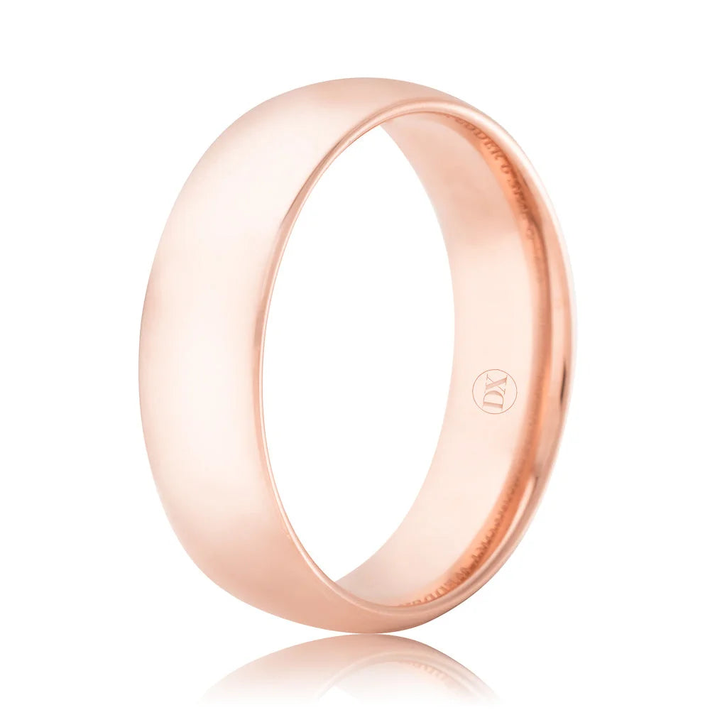 A plain, polished rose gold ring with a smooth, curved surface shown on a white background.