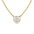 Gold chain necklace with a heart-shaped diamond pendant, set in a gold frame, on a white background.