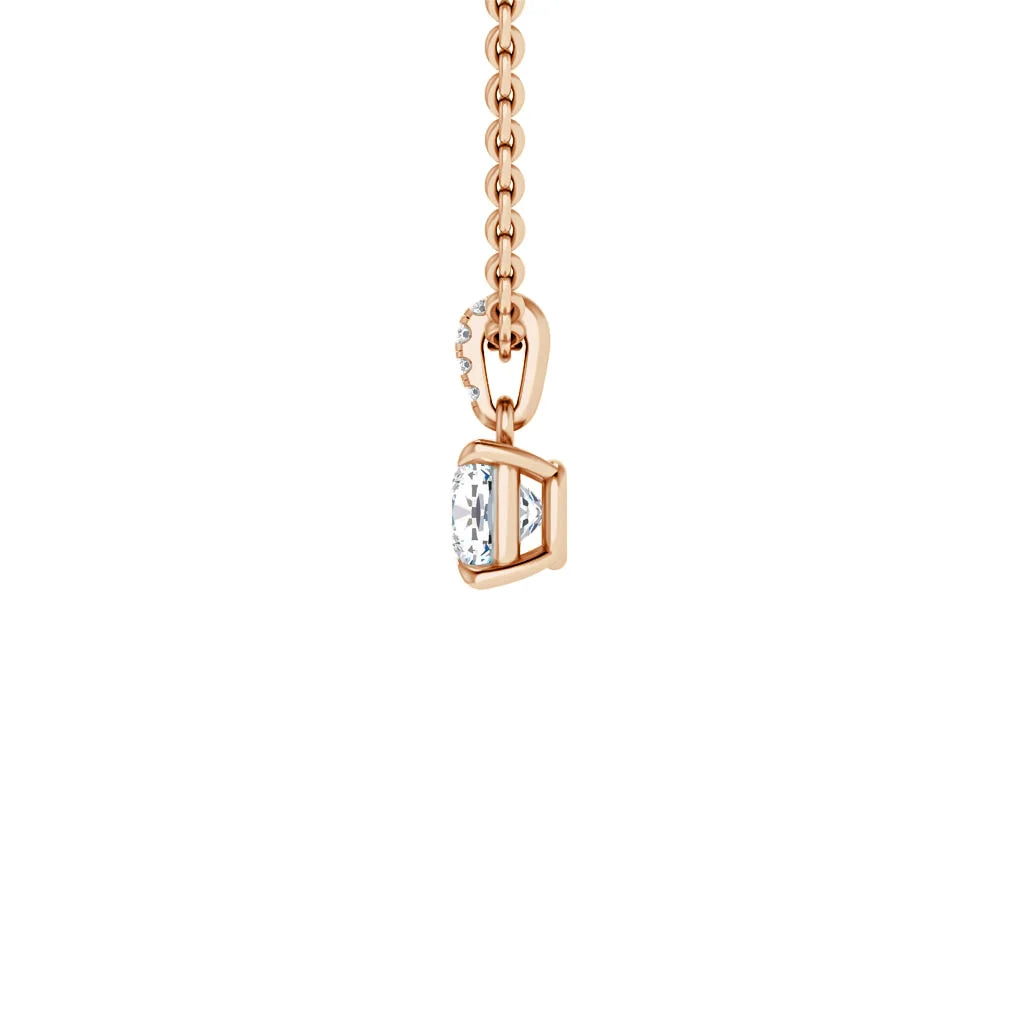 Rose gold chain necklace with a small, bezel-set round diamond pendant on a plain white background.