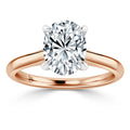 Oval diamond solitaire engagement ring with a rose gold band and four prongs, set against a white background.