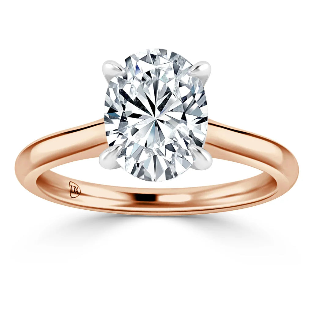 Oval diamond solitaire engagement ring with a rose gold band and four prongs, set against a white background.