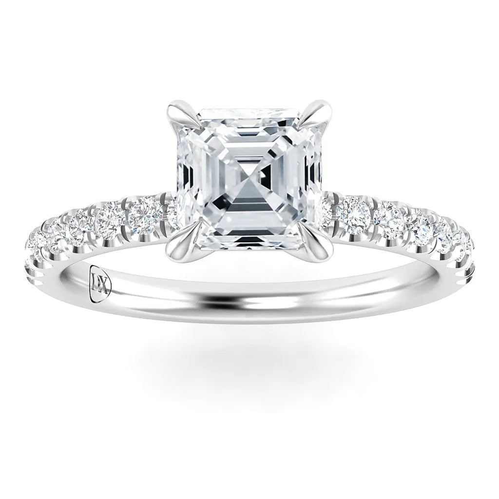 Platinum ring with an Asscher-cut diamond center and round diamonds on the band, shown on a white background.