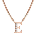 Rose gold chain necklace with a pendant shaped like the letter E, partly adorned with small white gemstones.