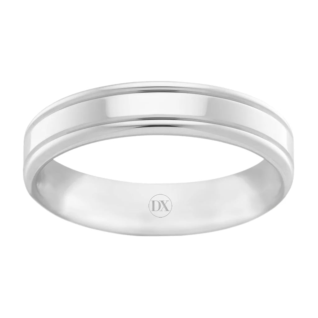 A polished silver ring with a subtle groove around the band and the letters DX engraved inside.
