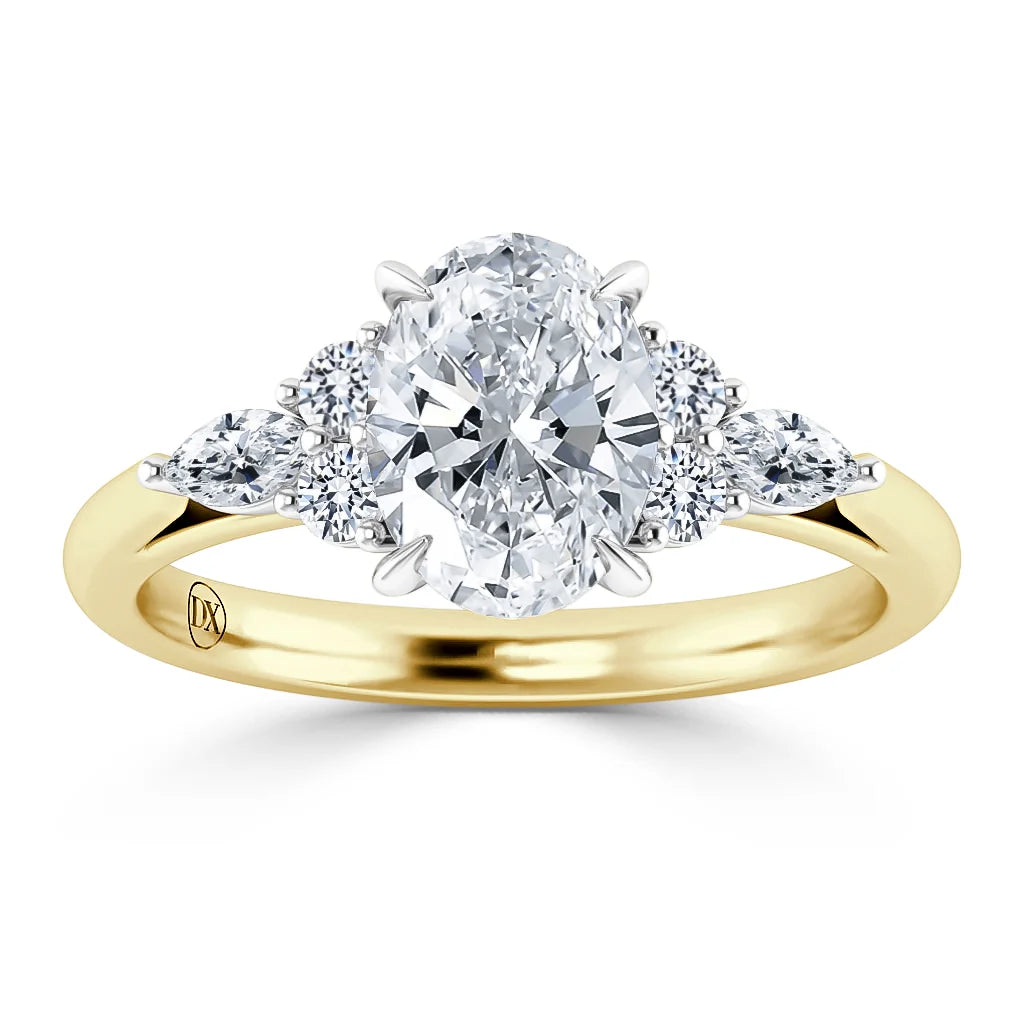 Oval diamond ring with two round and two marquise diamonds on a yellow gold band, viewed from the front.