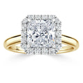 Gold ring with a square-cut diamond center, surrounded by a halo of smaller round diamonds.
