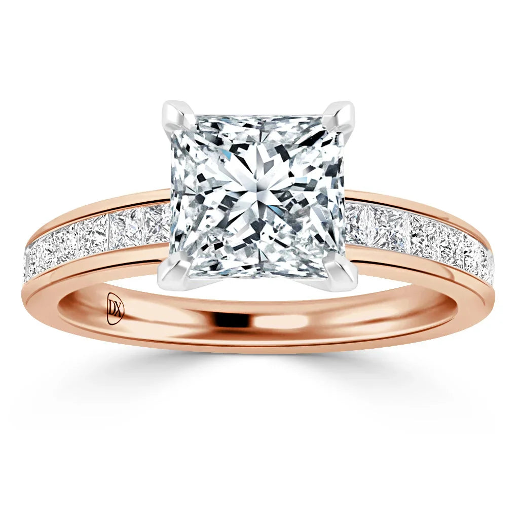 Rose gold ring with a large princess-cut diamond center and channel-set diamonds along the band.