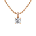 A rose gold chain necklace with a square-cut diamond pendant and small round diamonds above it.
