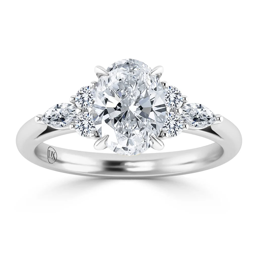 Platinum ring with an oval center diamond, flanked by two round and two marquise side diamonds.