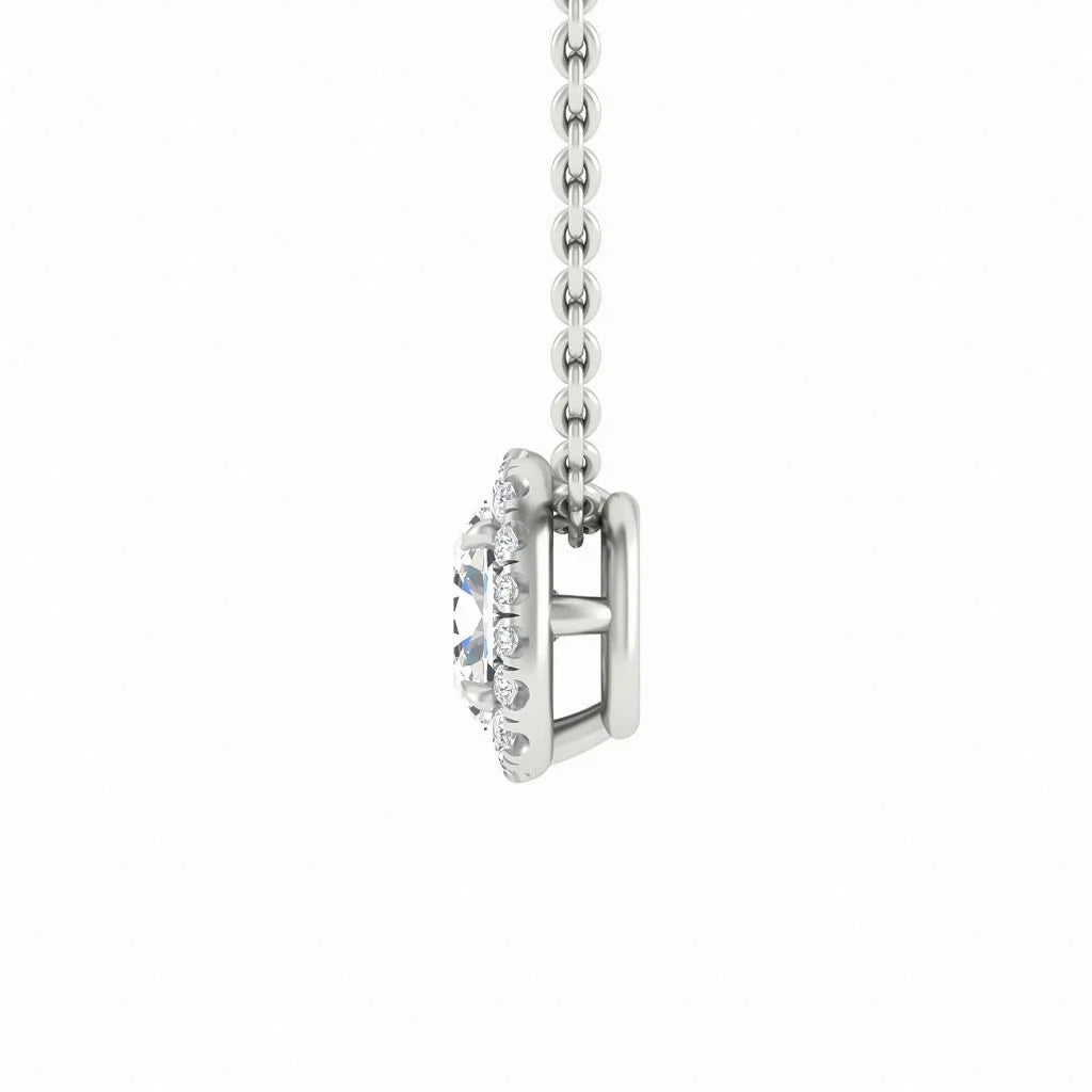 Side view of a silver necklace chain holding a round, halo-set gemstone pendant with small accent stones.