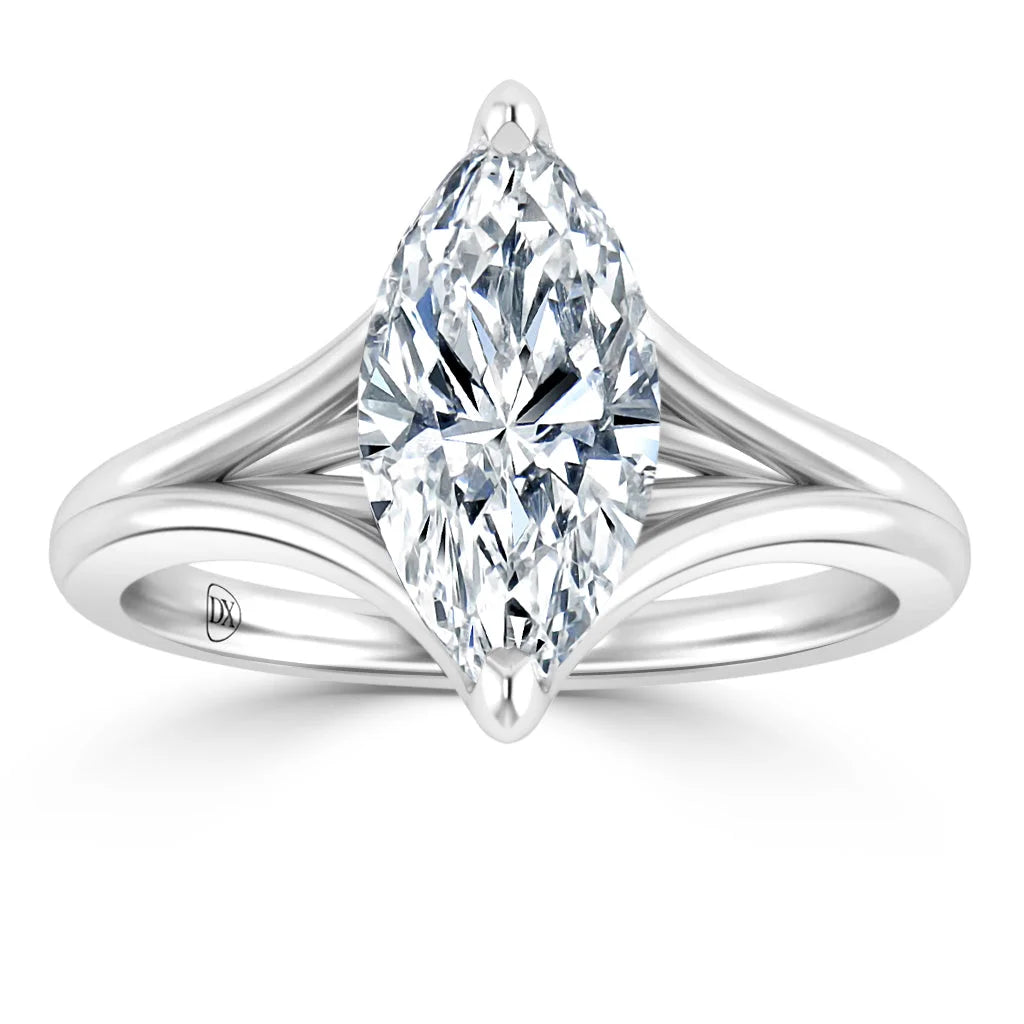A marquise-cut diamond solitaire ring with a split shank white gold band, displayed on a white background.