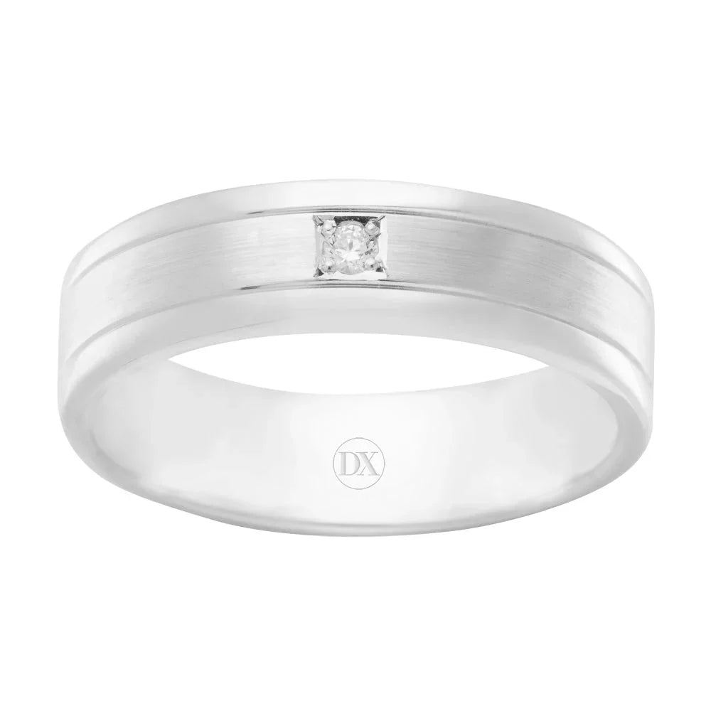 A silver band ring with a small square-set diamond in the center and a subtle groove detail on each side.