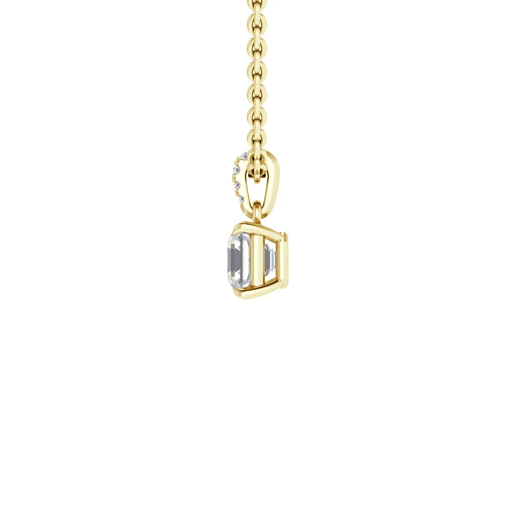 Gold chain necklace with a rectangular clear gemstone pendant set in gold, photographed on a white background.