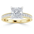 Gold ring with a large square diamond center and smaller diamonds set along the band.