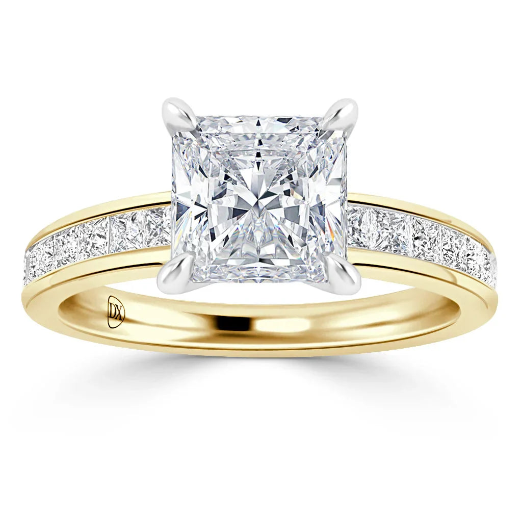 Gold ring with a large square diamond center and smaller diamonds set along the band.