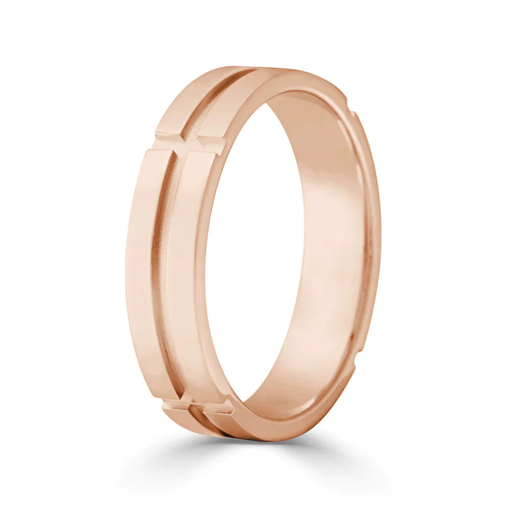 A rose gold ring with a matte finish and two parallel grooves encircling the band.