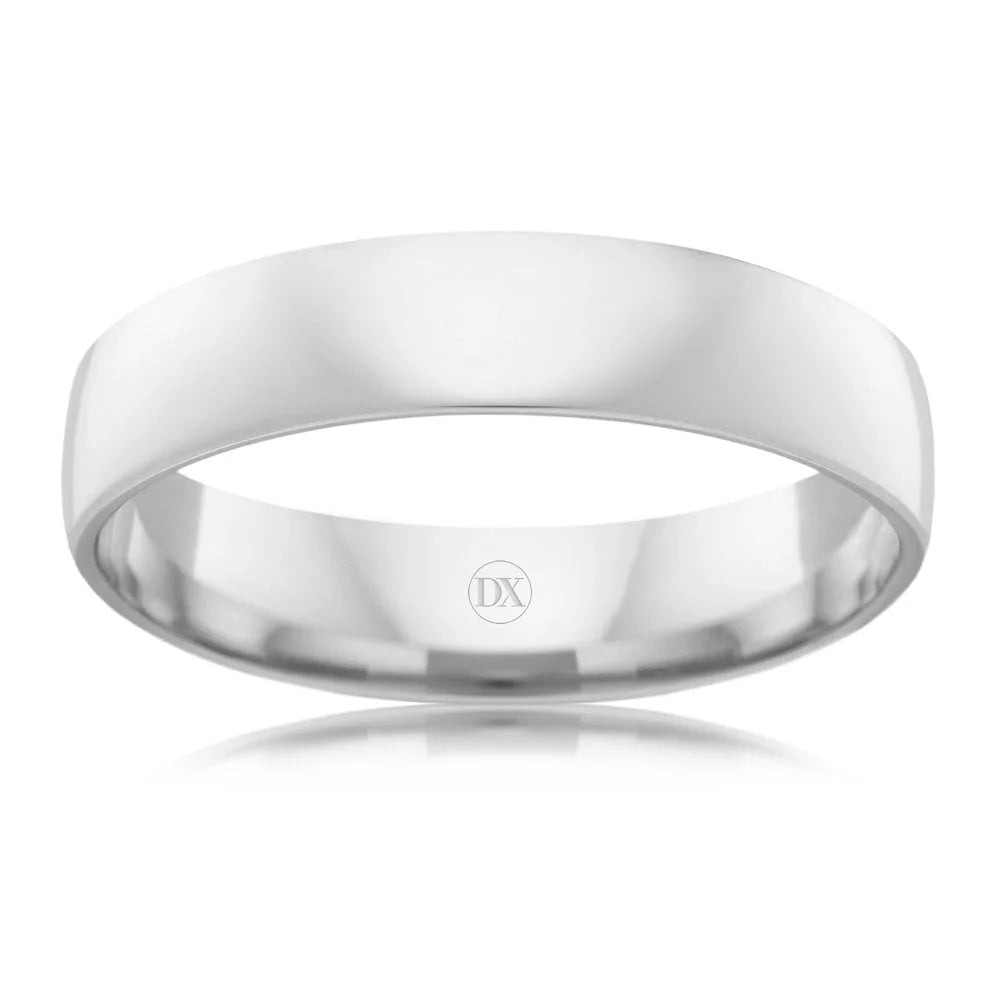 A plain, polished silver ring with a smooth surface and “DX” engraved on the inner band.