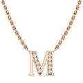 Gold chain necklace with a diamond-studded letter M pendant on a white background.
