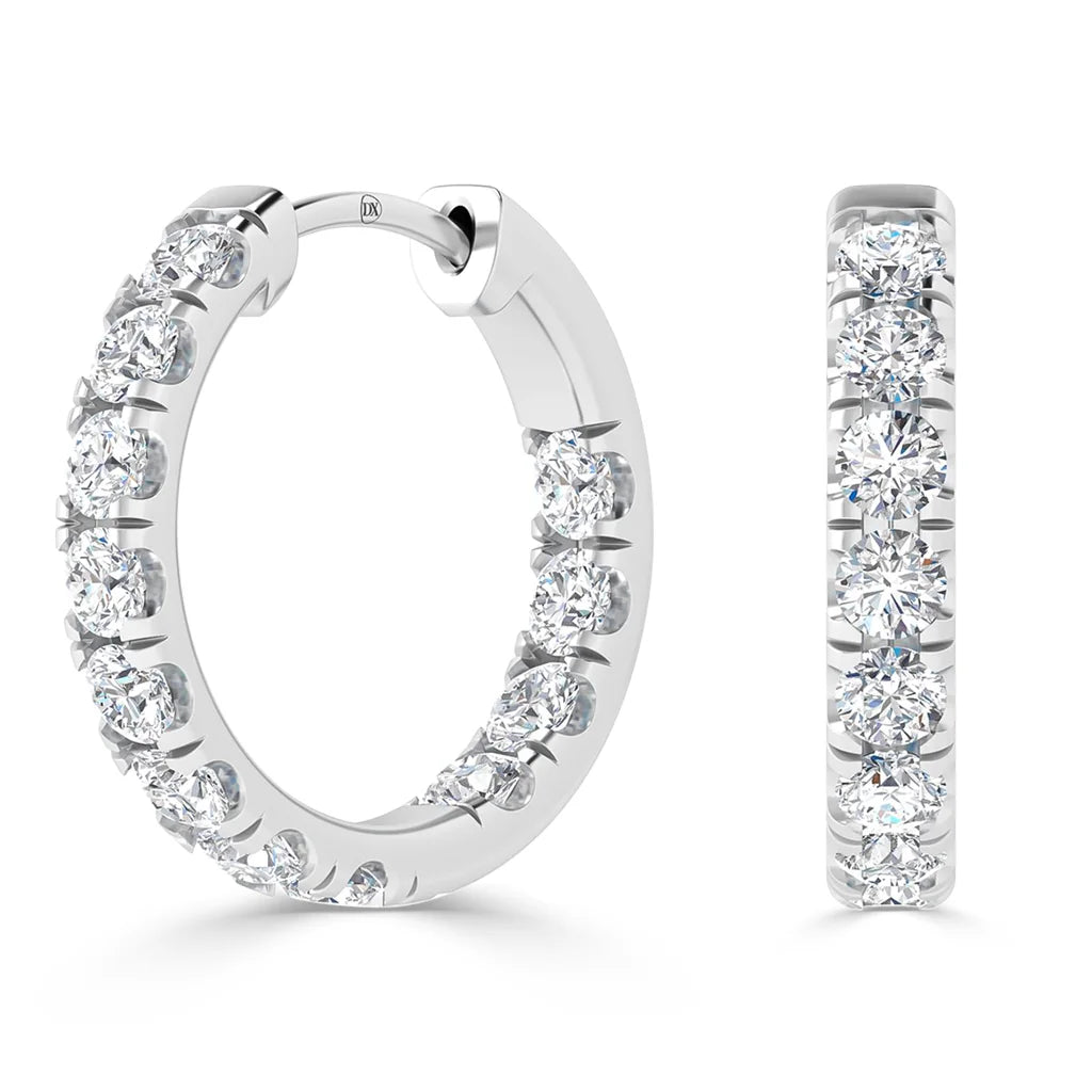 White gold hoop earrings, each encrusted with a row of round sparkling diamonds on the outer surface.