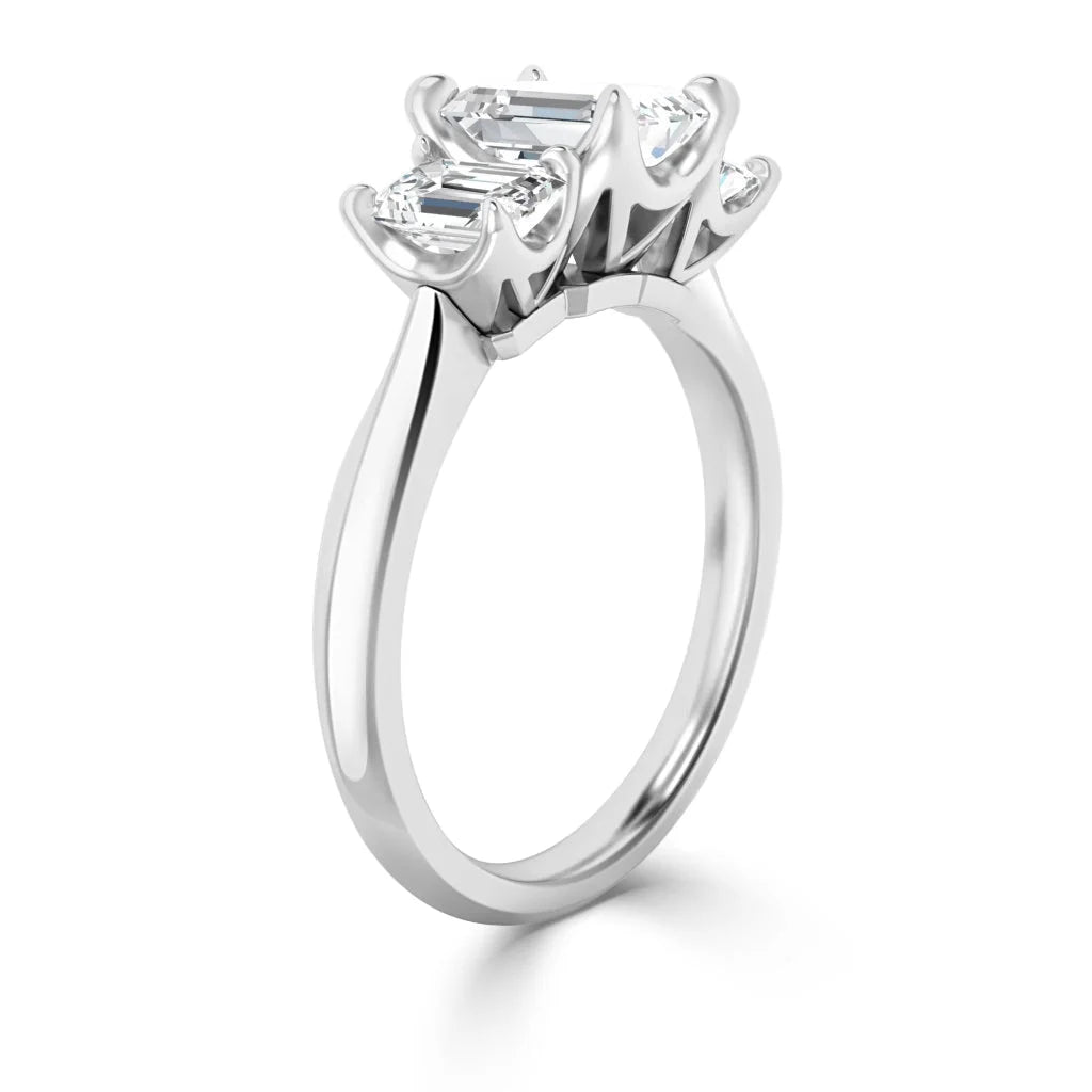 A silver ring with two rectangular diamonds set side by side in prong settings, shown from an angle.