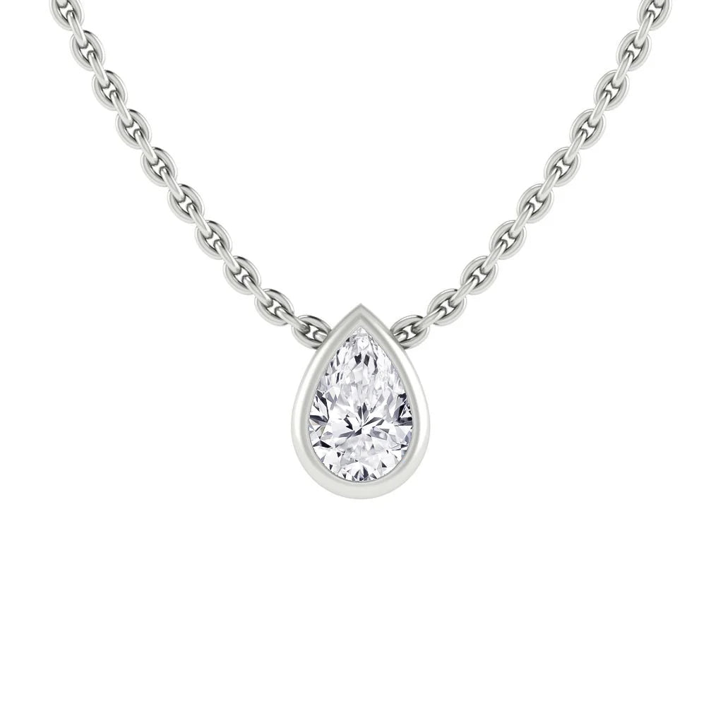 Silver chain necklace with a teardrop-shaped diamond pendant in a simple bezel setting, on white background.