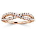 Rose gold infinity ring with two rows of round diamonds crossing at the center.