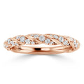 A rose gold ring with a twisted band design, set with small round diamonds along the braided pattern.