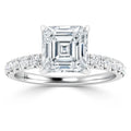 Asscher-cut diamond ring with a pavé band set in white gold, viewed from the front on a white background.
