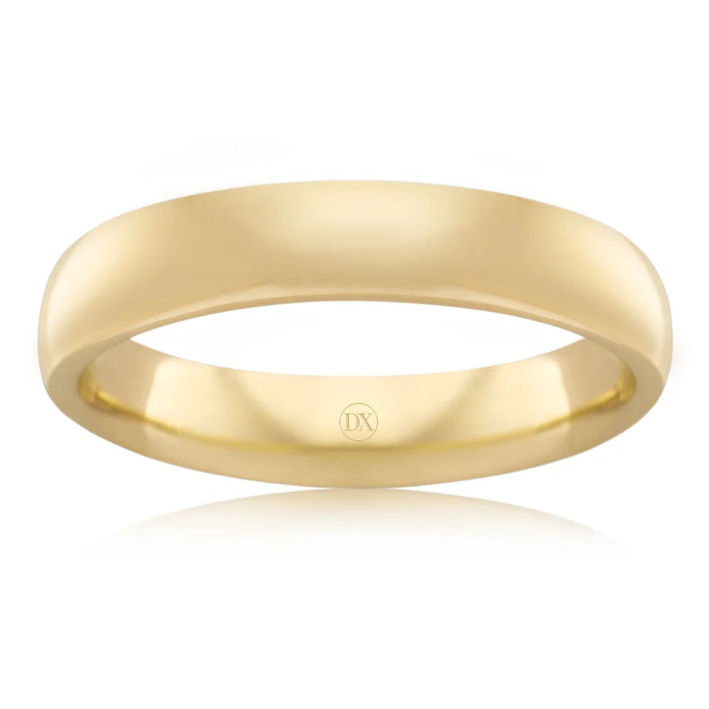Simple gold wedding band with a smooth, polished finish and a small “DX” engraving inside the ring.