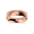 A plain, polished rose gold wedding band with a smooth, slightly rounded surface on a white background.