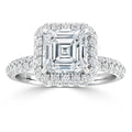 Square-cut diamond ring with a halo setting and pavé band, featuring sparkling accent diamonds throughout.