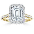 Gold ring with large emerald-cut diamond, haloed by smaller diamonds, and a diamond-encrusted band.