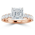 Rose gold ring with an Asscher-cut diamond center and round diamonds set along the band.