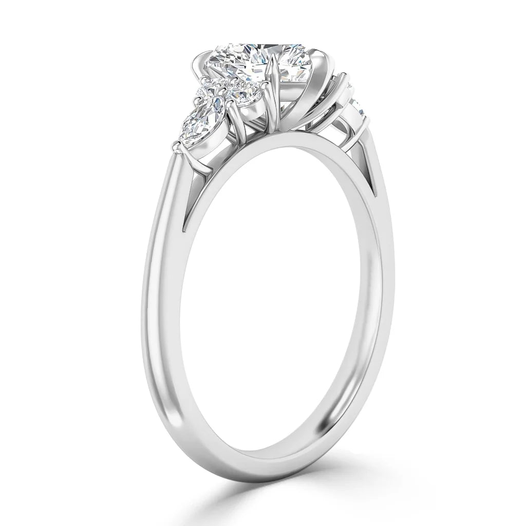 Side view of a sleek silver ring with three sparkling round diamonds in a prong setting.