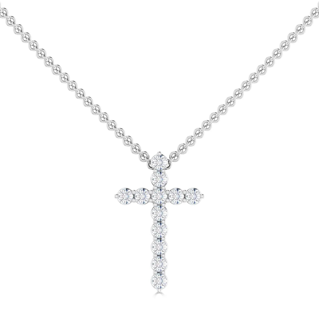 Silver chain necklace with a cross pendant made of small round diamonds on a white background.