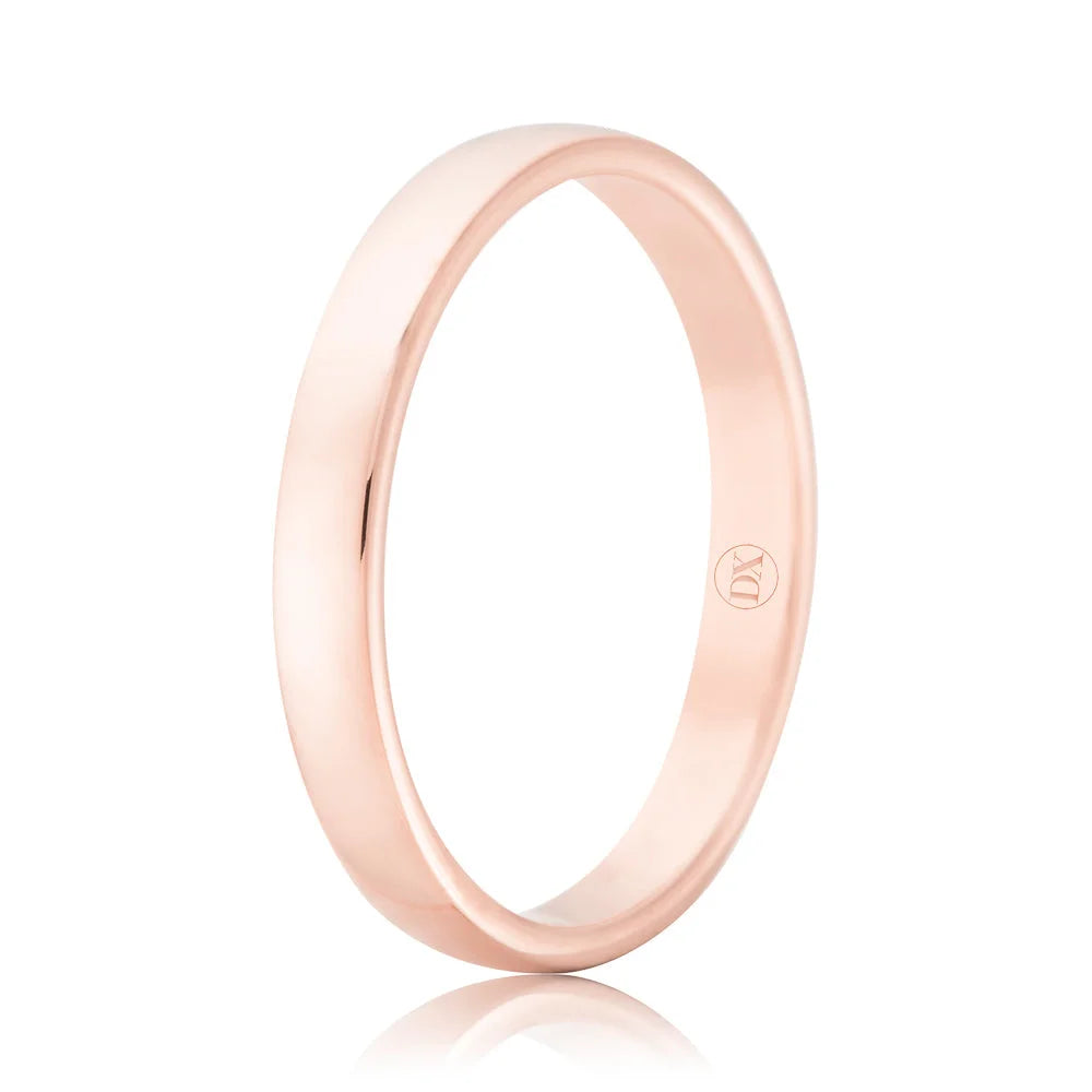 A simple, polished rose gold ring with a smooth surface and a small engraved logo on the inner band.