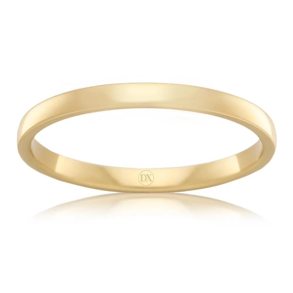 Simple, thin yellow gold band ring with a polished finish, viewed from a slightly tilted angle.