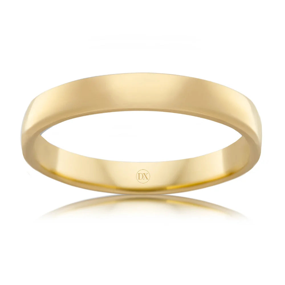 Simple, polished yellow gold band ring with a smooth surface and a subtle DX engraving inside.