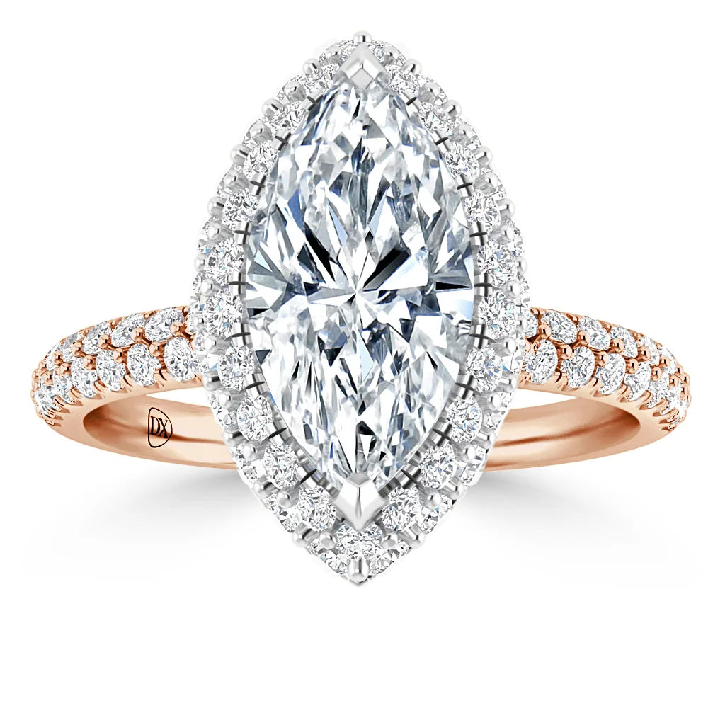 A marquise-cut diamond ring with a halo of small diamonds on a rose gold diamond-accented band.