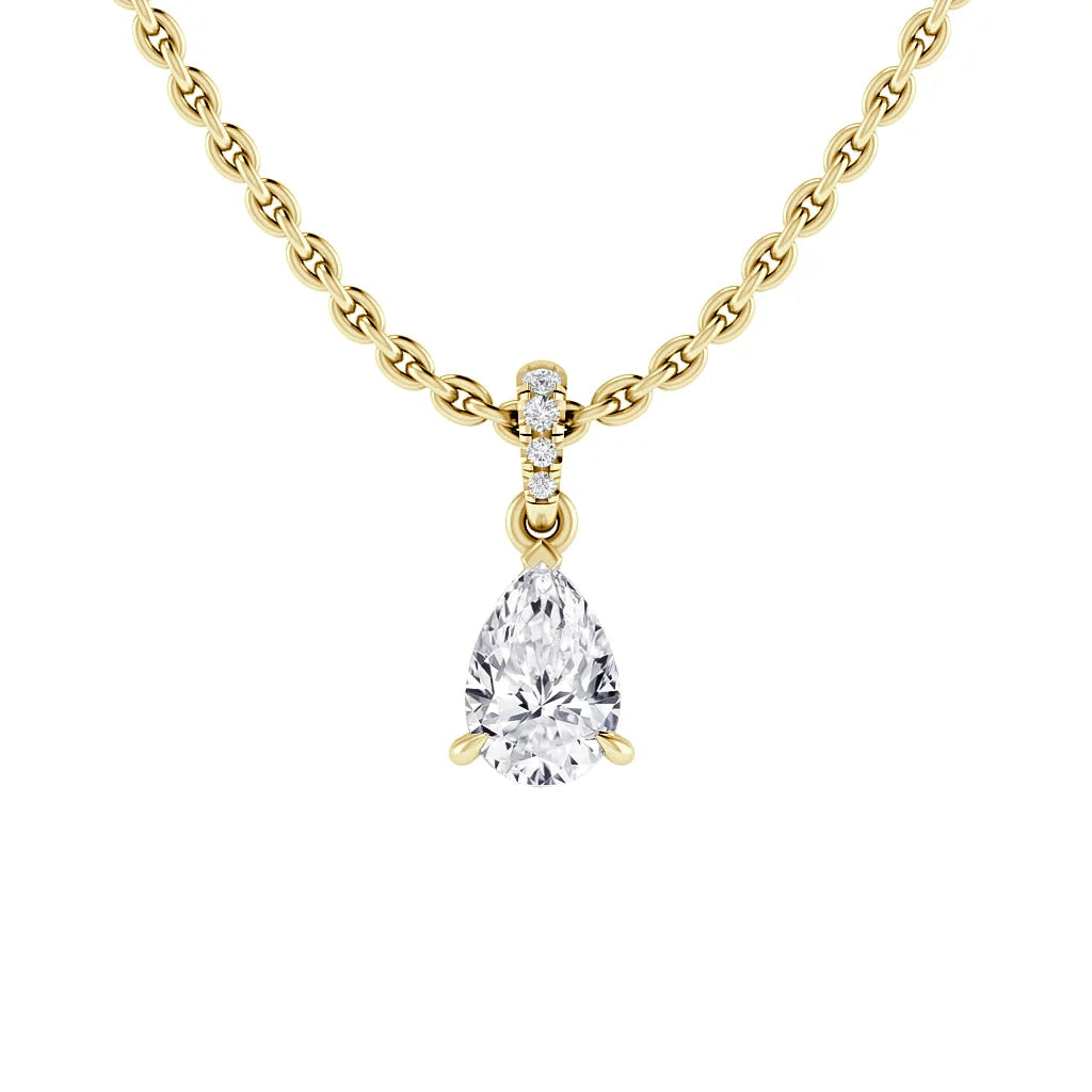Gold chain necklace with a pear-shaped diamond pendant and small round diamonds on the bail.