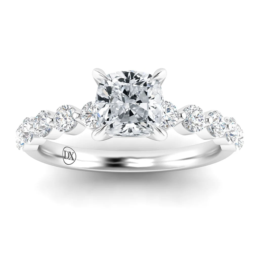 White gold ring with cushion-cut center diamond and round diamonds along the band, viewed from the front.