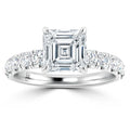 Platinum ring with an Asscher-cut diamond center and round diamonds set along the band.