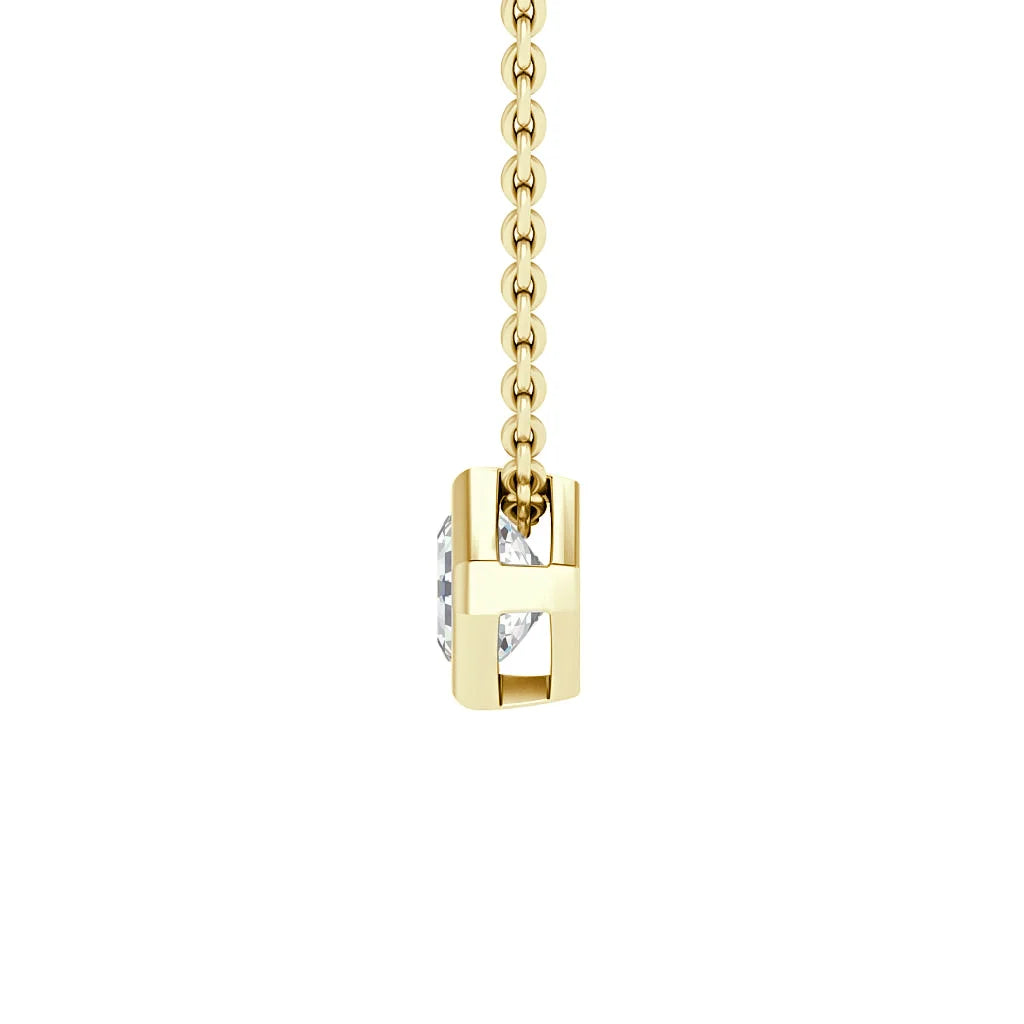 A gold chain necklace with a square pendant holding a clear gemstone in a geometric gold setting.
