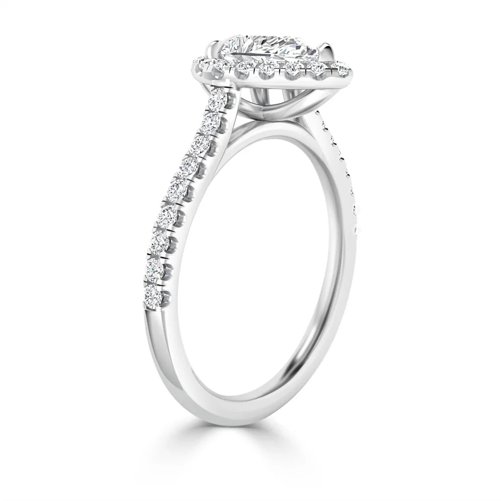 A white gold engagement ring with a round center diamond, halo setting, and diamonds on the band.