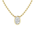 A gold chain necklace with an oval-cut diamond pendant set in a gold bezel, centered on a white background.