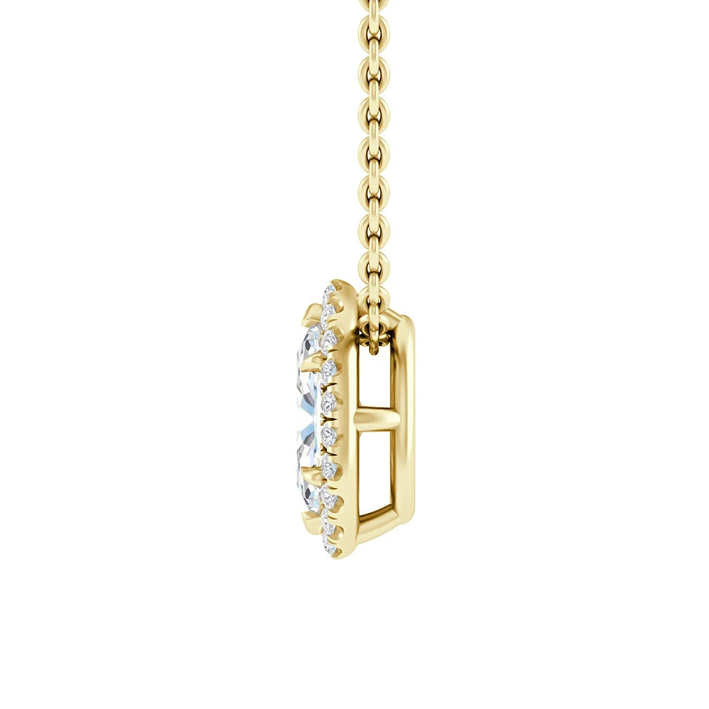 Side view of a gold necklace with a round diamond pendant bordered by smaller diamonds.