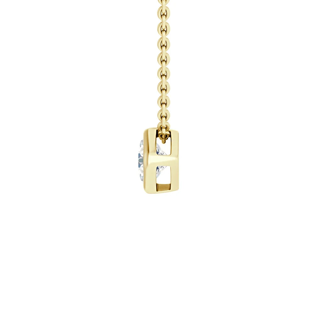Gold chain necklace with a rectangular gold pendant holding a clear gemstone, shown against a white background.