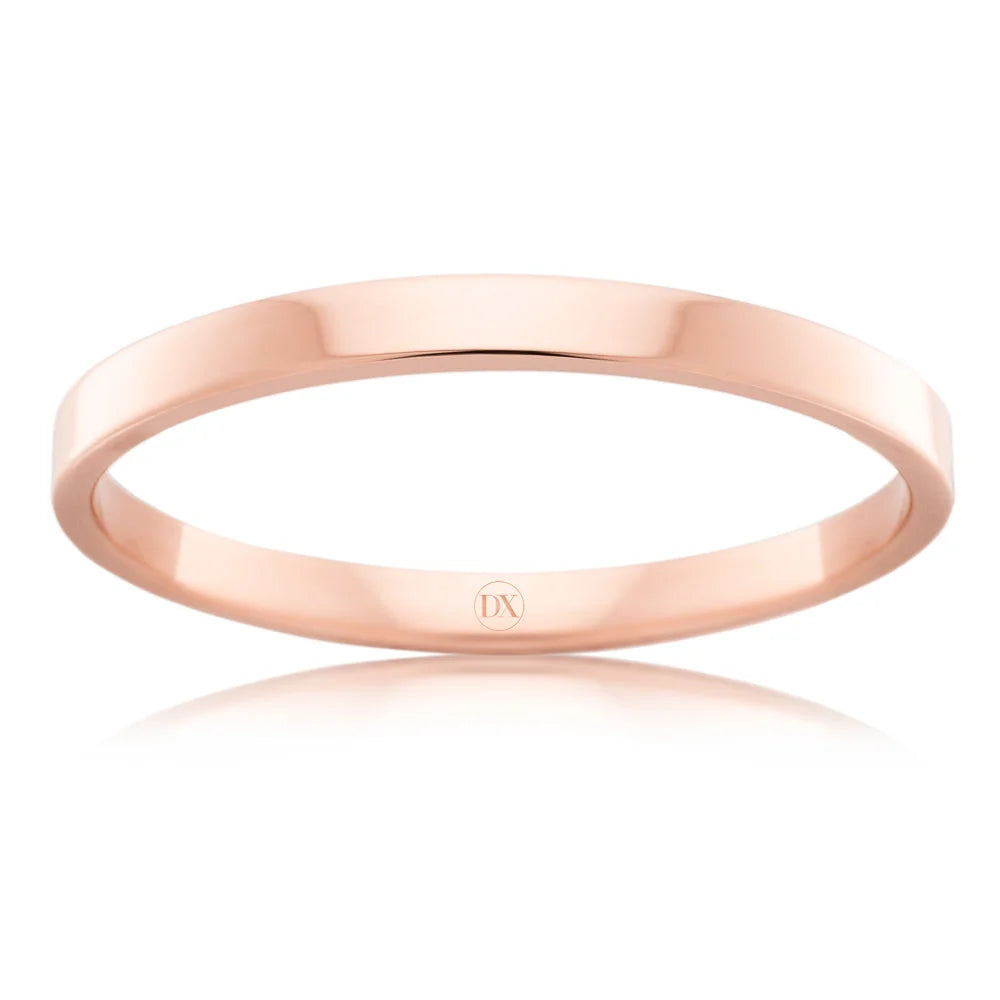 A simple, polished rose gold band ring with a smooth surface, displayed on a white background.