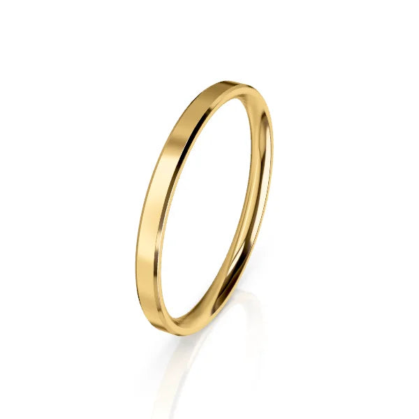 A simple, thin gold band ring is shown on a white background with a slight shadow beneath it.